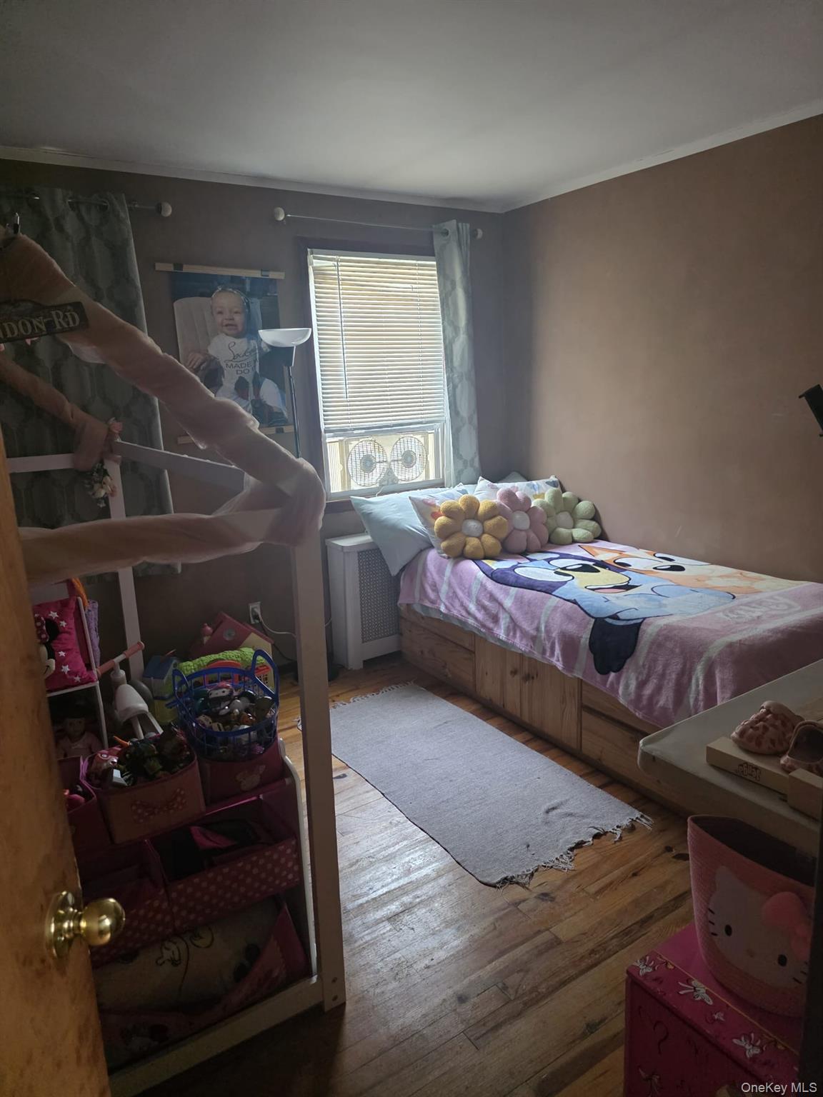 23 Seaman Neck Road Dix Hills, NY 11746 - Photo 7 of 12 a bed room with a bed and a window