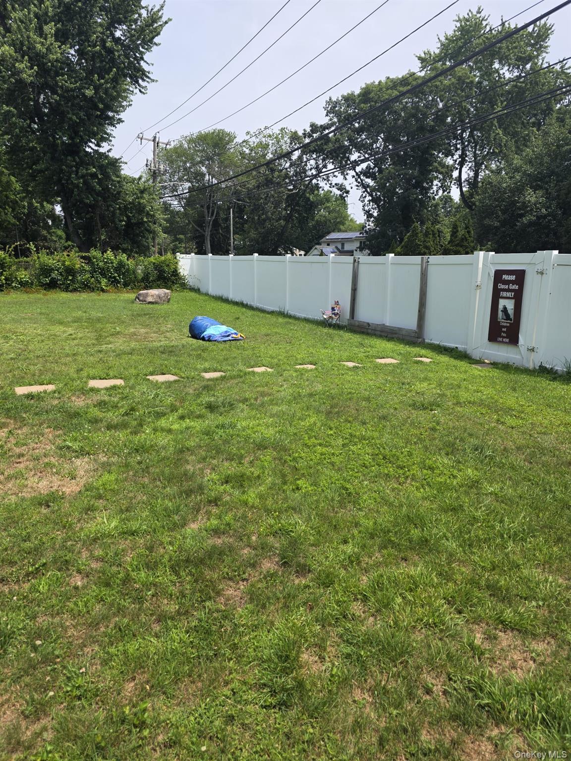 23 Seaman Neck Road Dix Hills, NY 11746 - Photo 9 of 12 a view of a backyard with a small pool