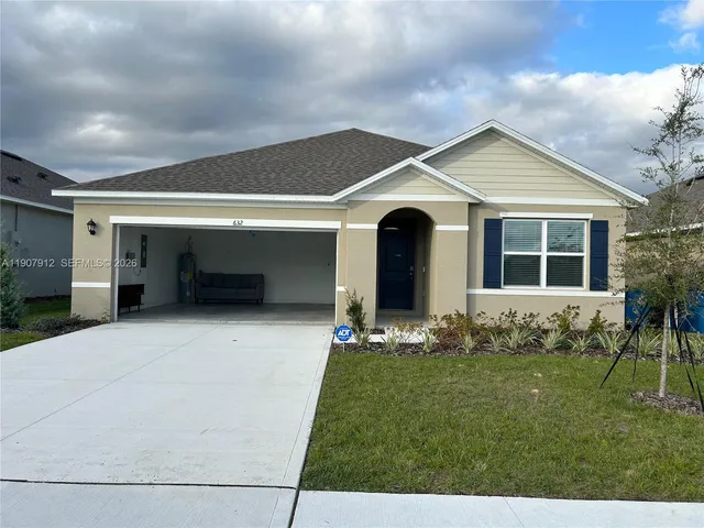 a front view of house with yard