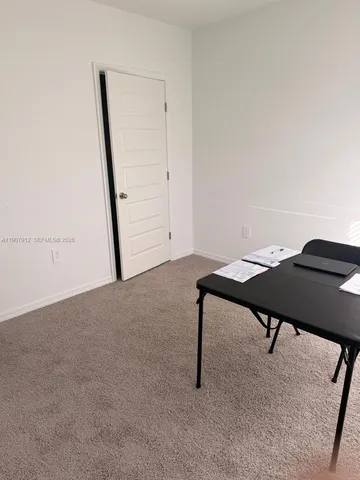 a room with furniture and wooden floor