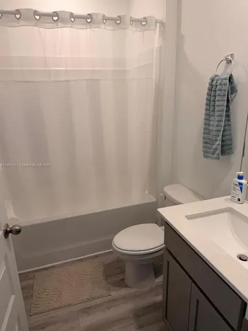 a bathroom with a toilet and a sink