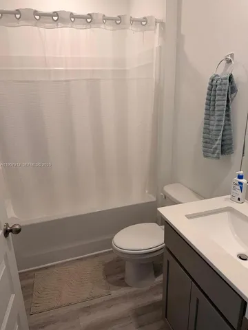 a bathroom with a toilet and a sink