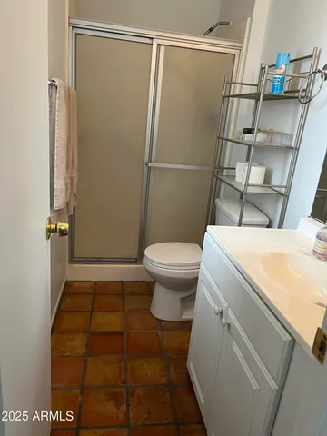 a bathroom with a sink and toilet