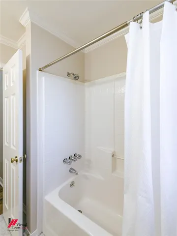 a spacious bathroom with a double vanity sink toilet and a tub