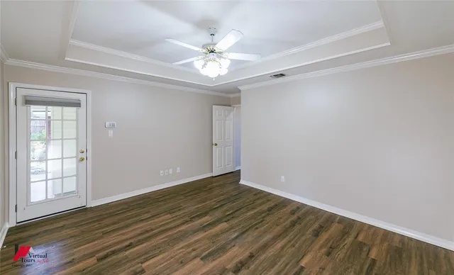 a bathroom with a bathtub a shower and a window