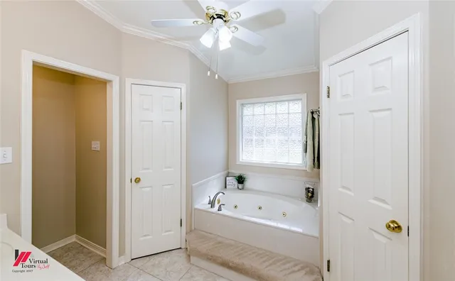 a bathroom with a tub and a window