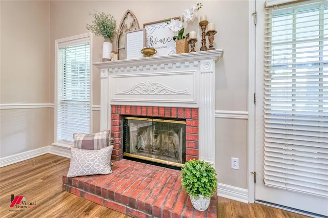 a front view of a house with yard and green space