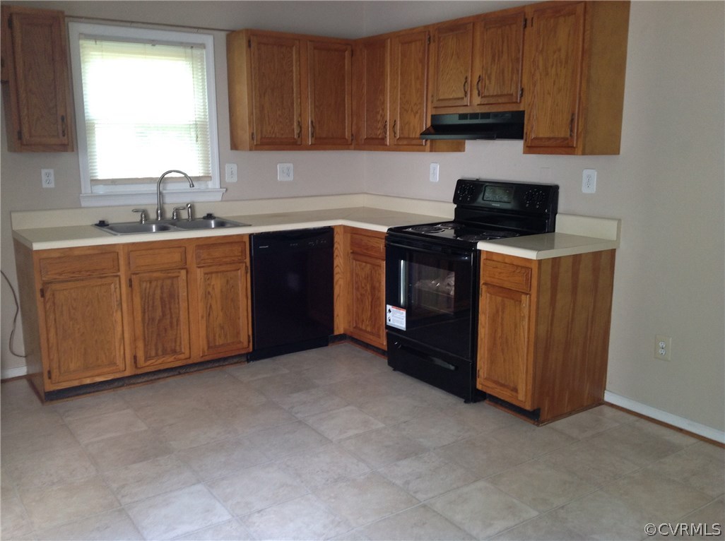4831 Alberta Road Chesterfield, VA 23832 - Photo 2 of 6 a kitchen with sink cabinets and window