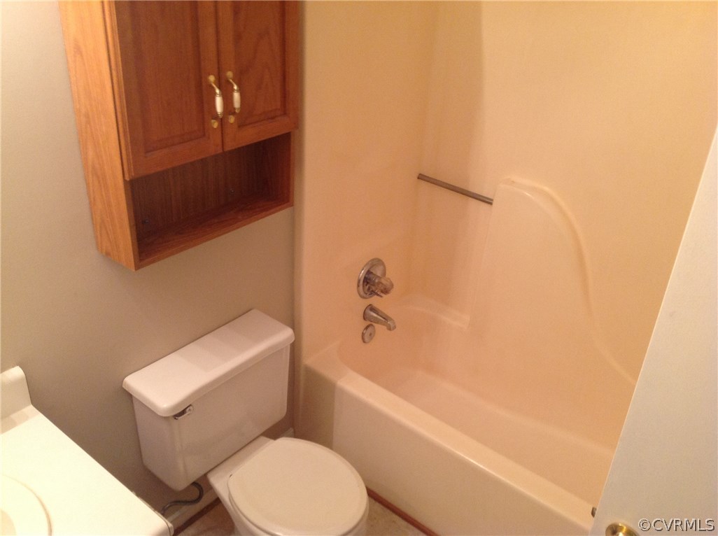 4831 Alberta Road Chesterfield, VA 23832 - Photo 6 of 6 a white toilet sitting next to a bath tub