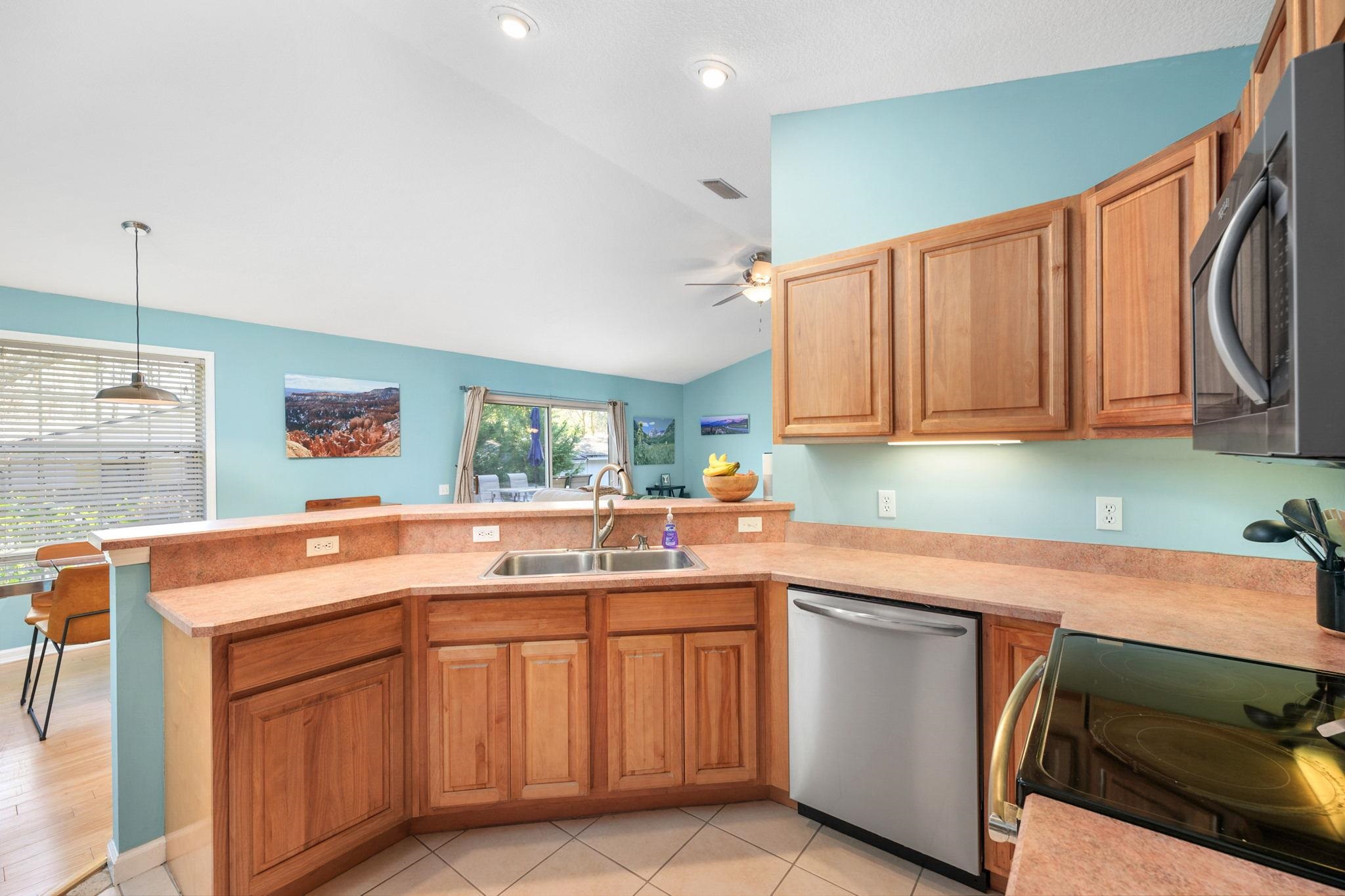 235 Shamrock Road St. Augustine, FL 32086 - Photo 12 of 28 a kitchen with a sink and cabinets