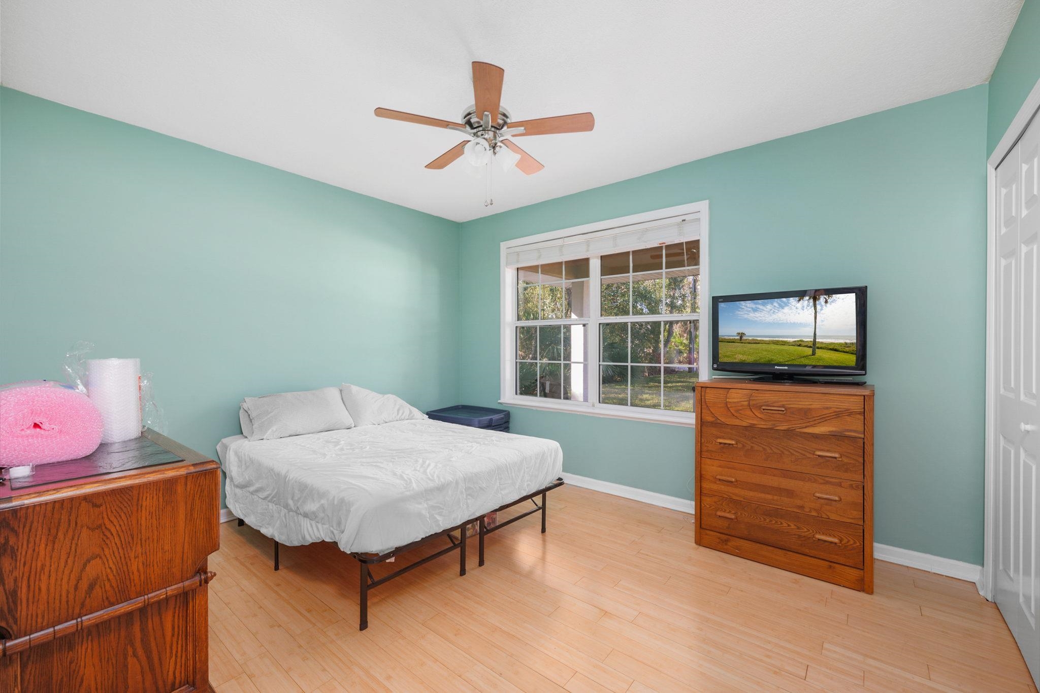 235 Shamrock Road St. Augustine, FL 32086 - Photo 15 of 28 a bedroom with a bed and a window