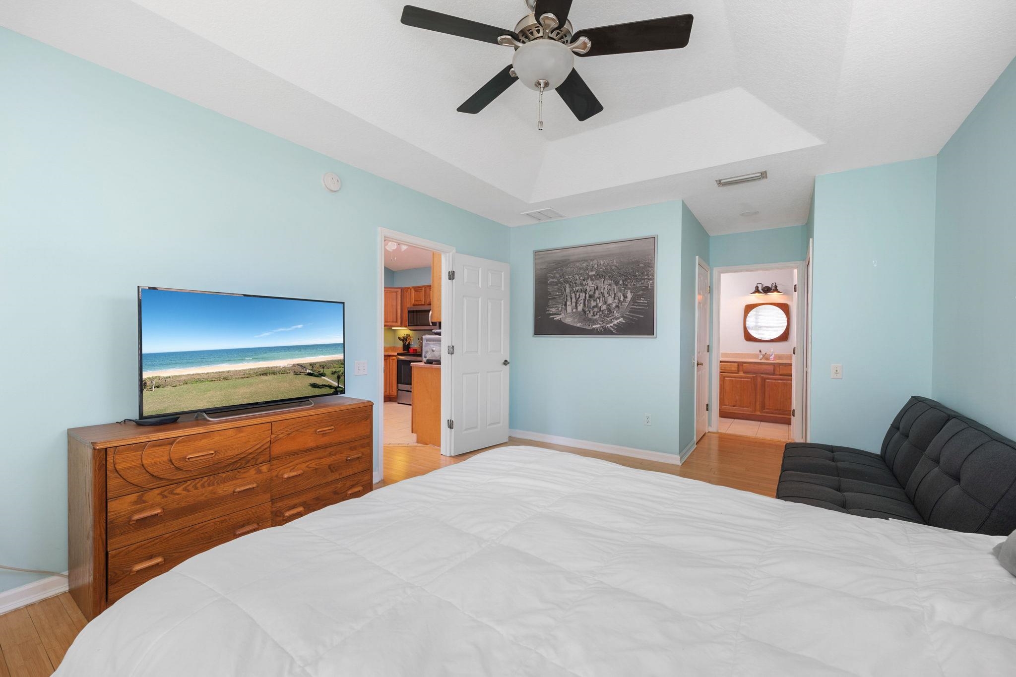235 Shamrock Road St. Augustine, FL 32086 - Photo 18 of 28 a bedroom with a bed and a flat screen tv