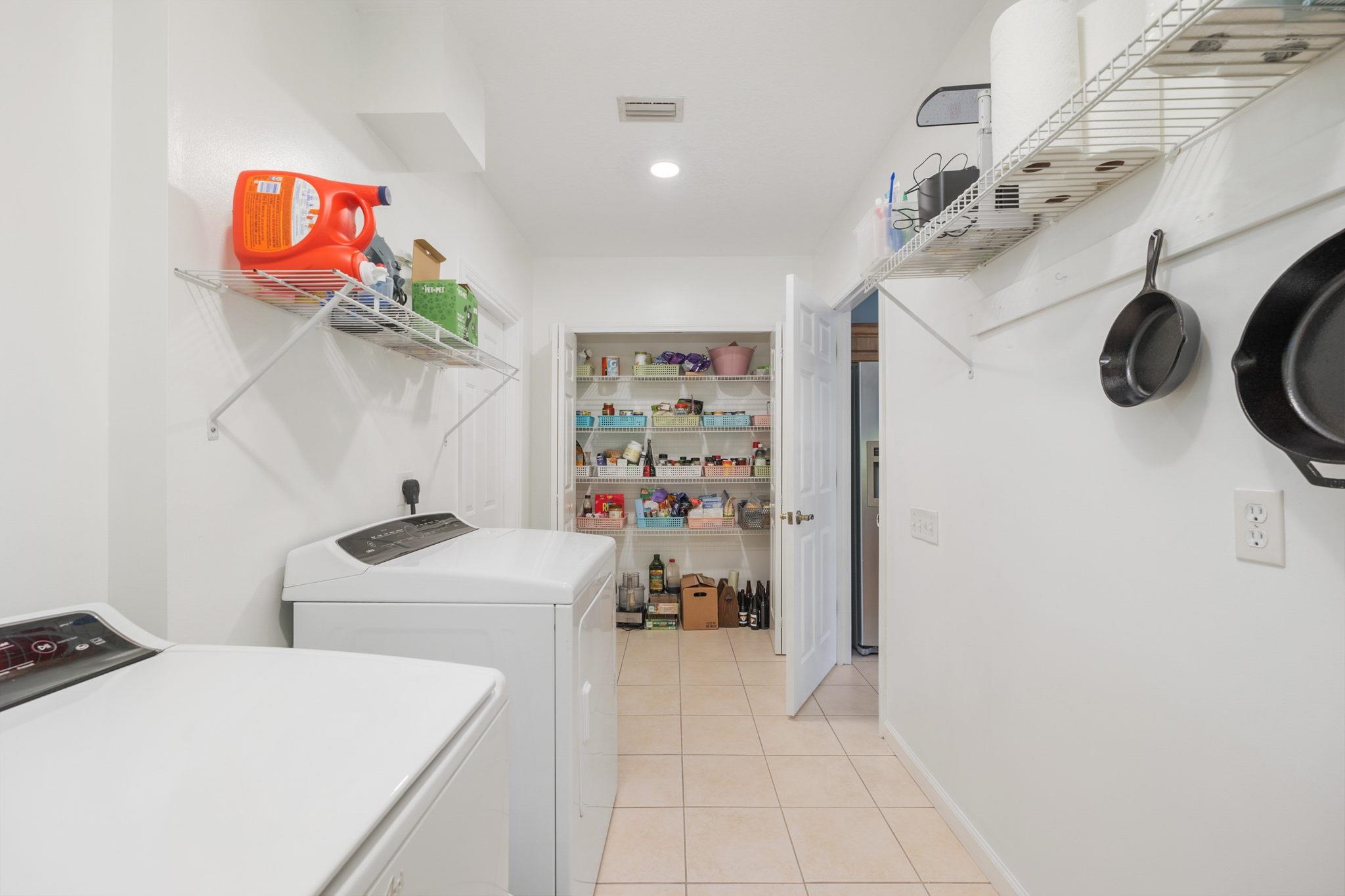 235 Shamrock Road St. Augustine, FL 32086 - Photo 22 of 28 a view of a storage & utility room with two washing machine