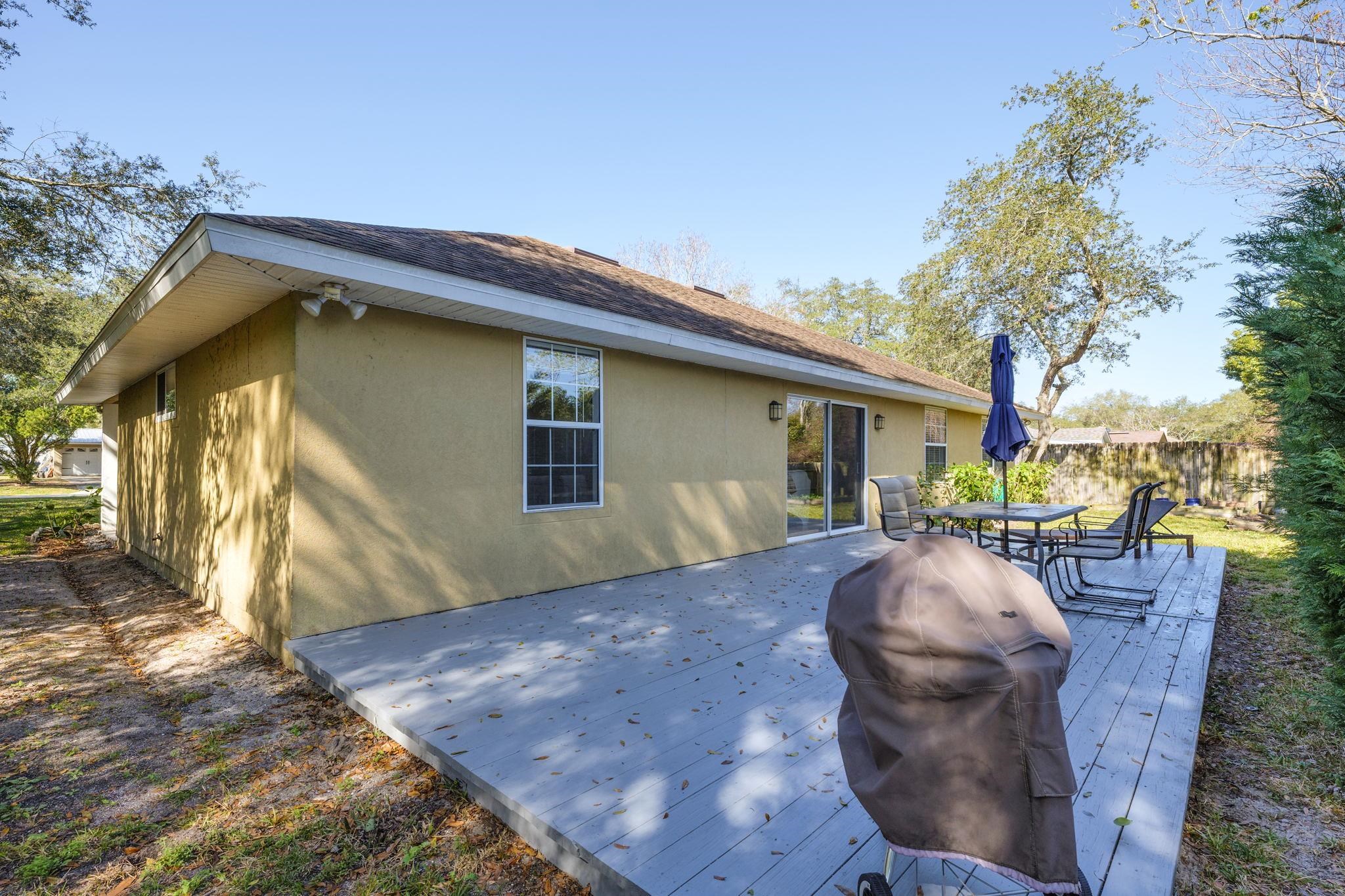235 Shamrock Road St. Augustine, FL 32086 - Photo 25 of 28 a view of a house with a patio