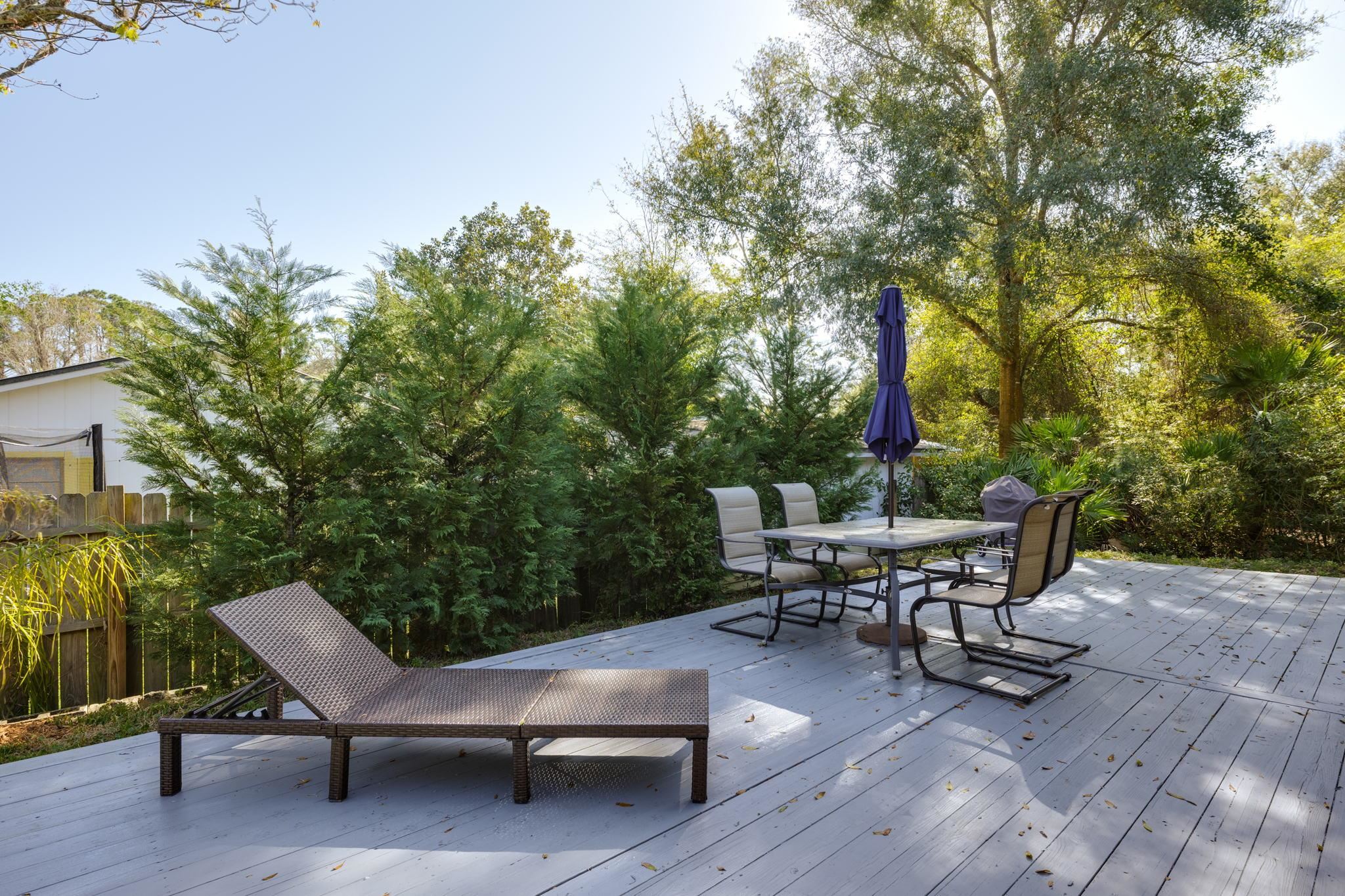 235 Shamrock Road St. Augustine, FL 32086 - Photo 26 of 28 a view of a chairs and table in the patio