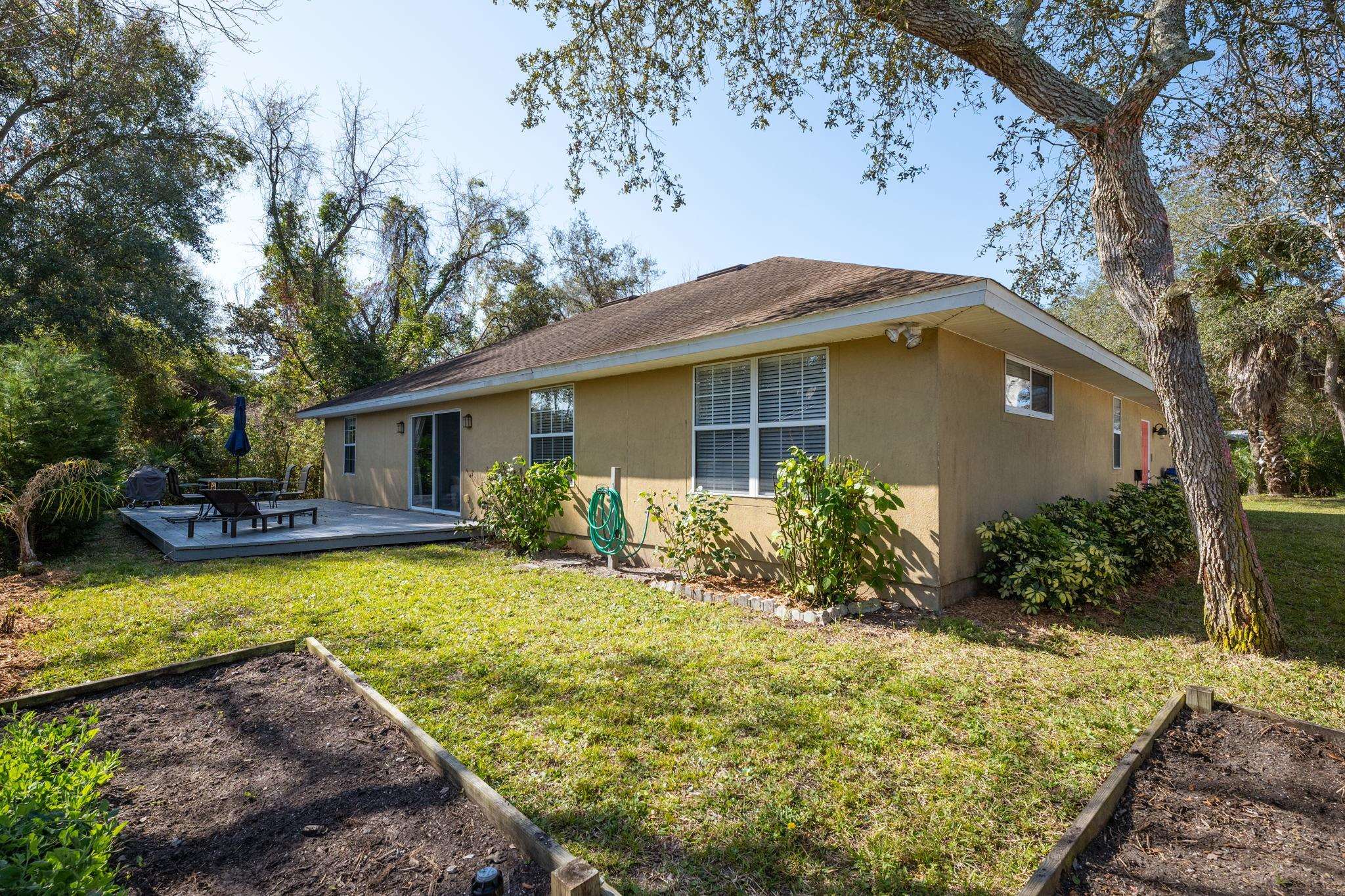 235 Shamrock Road St. Augustine, FL 32086 - Photo 28 of 28 a view of a house with swimming pool in front of it