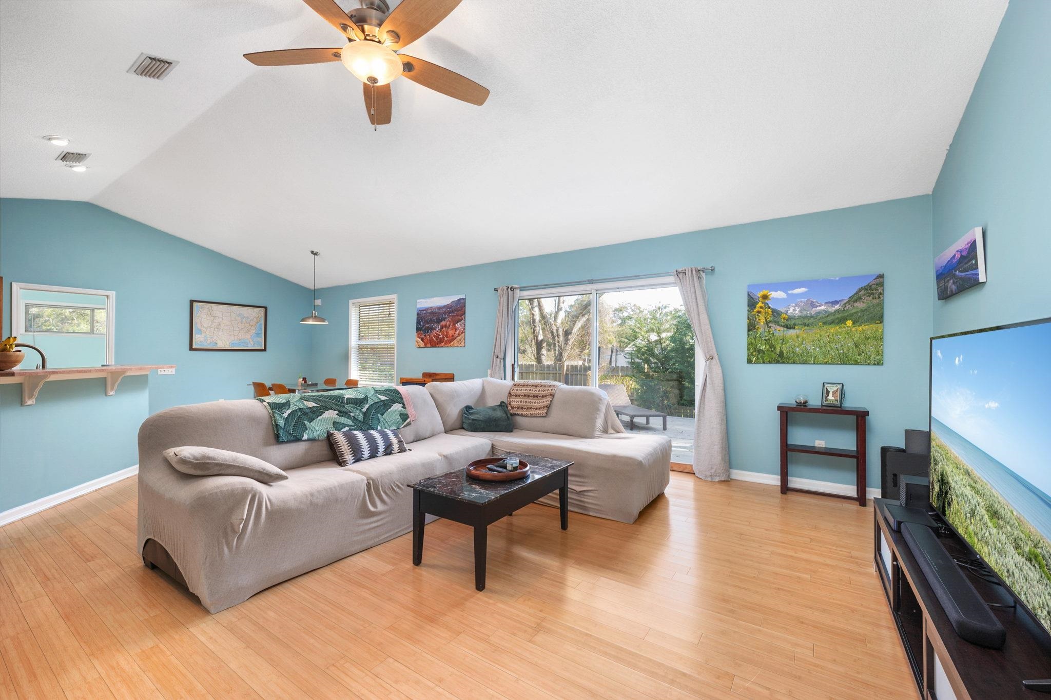 235 Shamrock Road St. Augustine, FL 32086 - Photo 8 of 28 a living room with furniture and a wooden floor