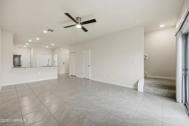 a view of a kitchen with a sink and a window