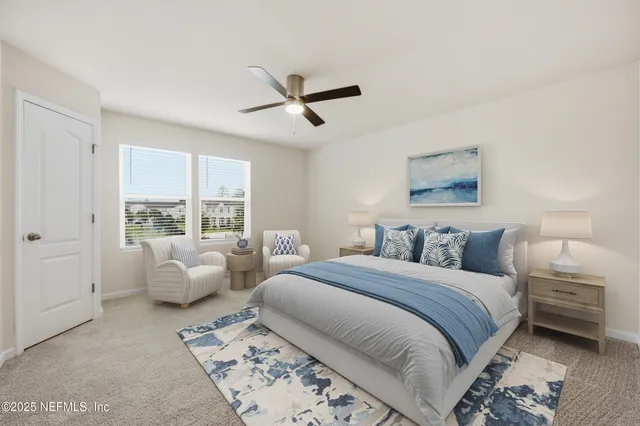 a bedroom with a bed and glass window