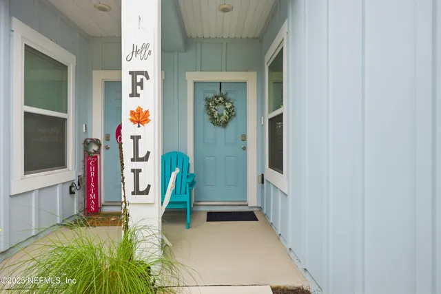 a view of an entryway with wooden floor