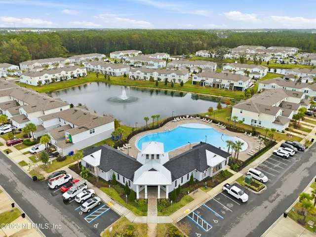 swimming pool view with a garden space