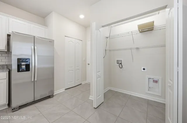 a bathroom with a shower and a glass door