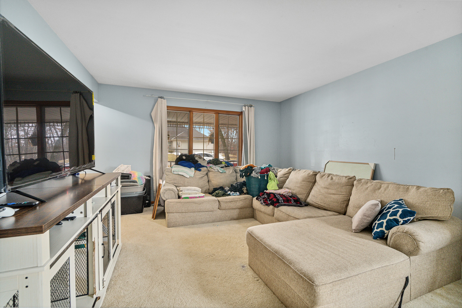 621 Huntley Terrace Crete, IL 60417 - Photo 2 of 31 a living room with furniture and a flat screen tv