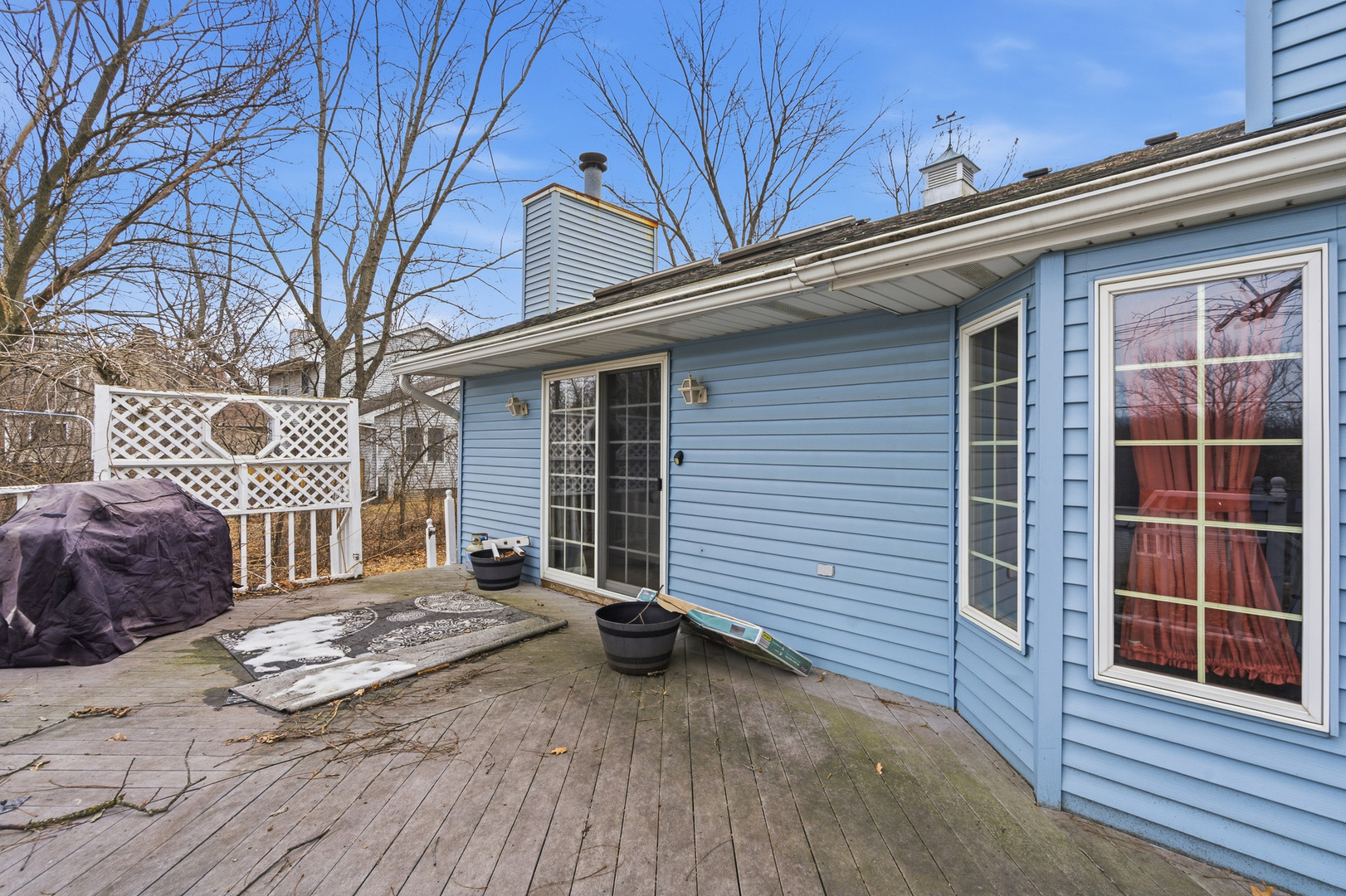 621 Huntley Terrace Crete, IL 60417 - Photo 26 of 31 a view of a house with a large window and wooden fence
