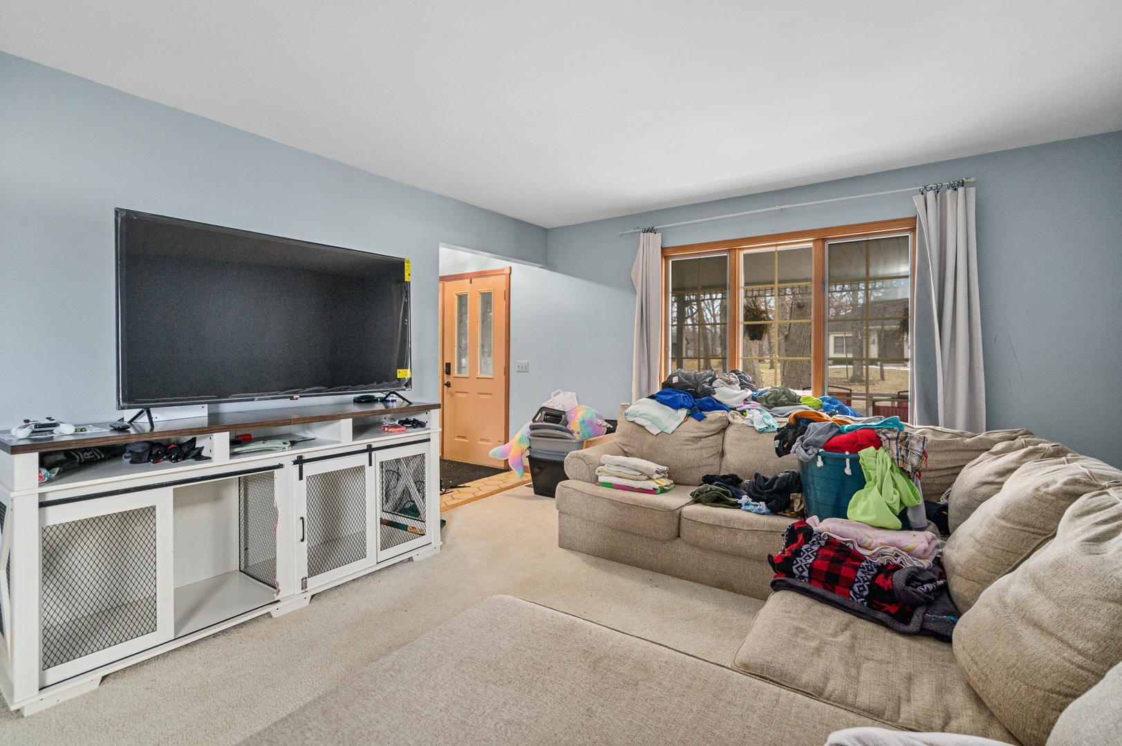 621 Huntley Terrace Crete, IL 60417 - Photo 3 of 31 a living room with furniture and a flat screen tv