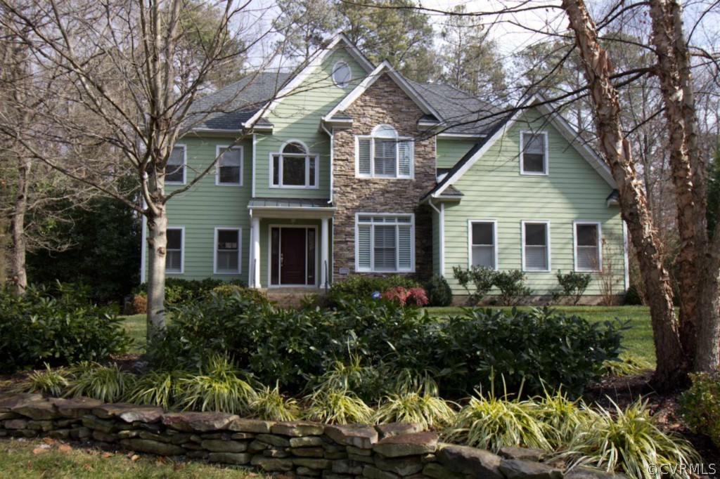 10224 Sioux Road Richmond, VA 23235 - Photo 1 of 24 a front view of a house with a yard