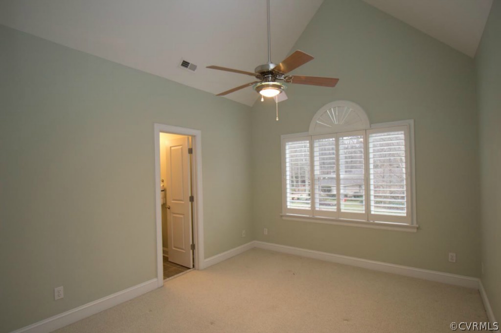 10224 Sioux Road Richmond, VA 23235 - Photo 13 of 24 an empty room with chandelier fan and windows