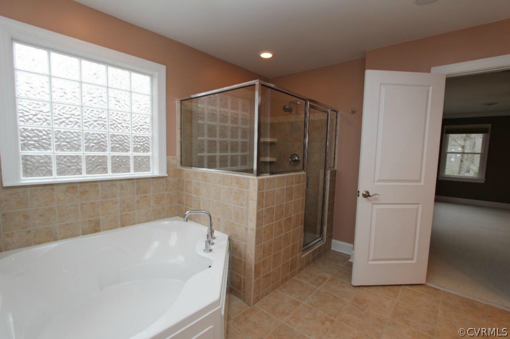 10224 Sioux Road Richmond, VA 23235 - Photo 16 of 24 a bathroom with a tub and shower