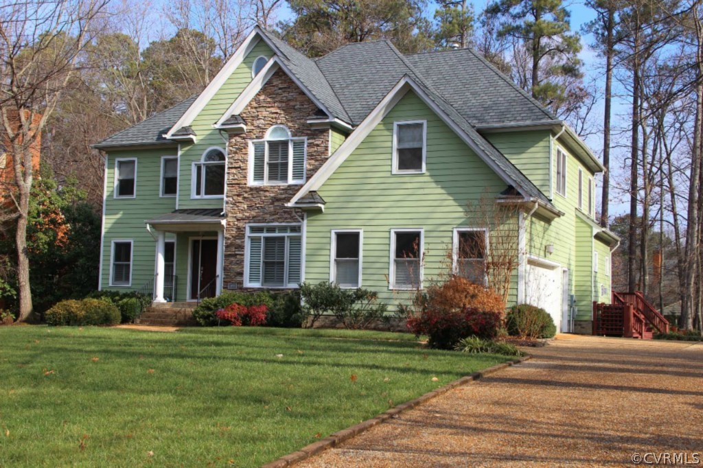 10224 Sioux Road Richmond, VA 23235 - Photo 2 of 24 a front view of a house with garden