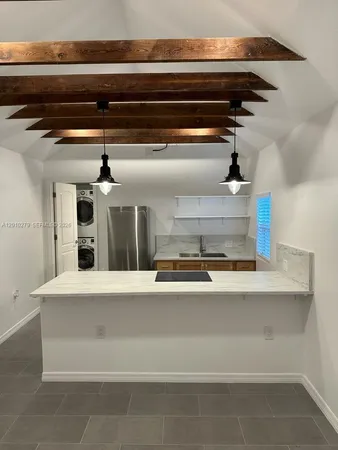 a view of a refrigerator in a kitchen