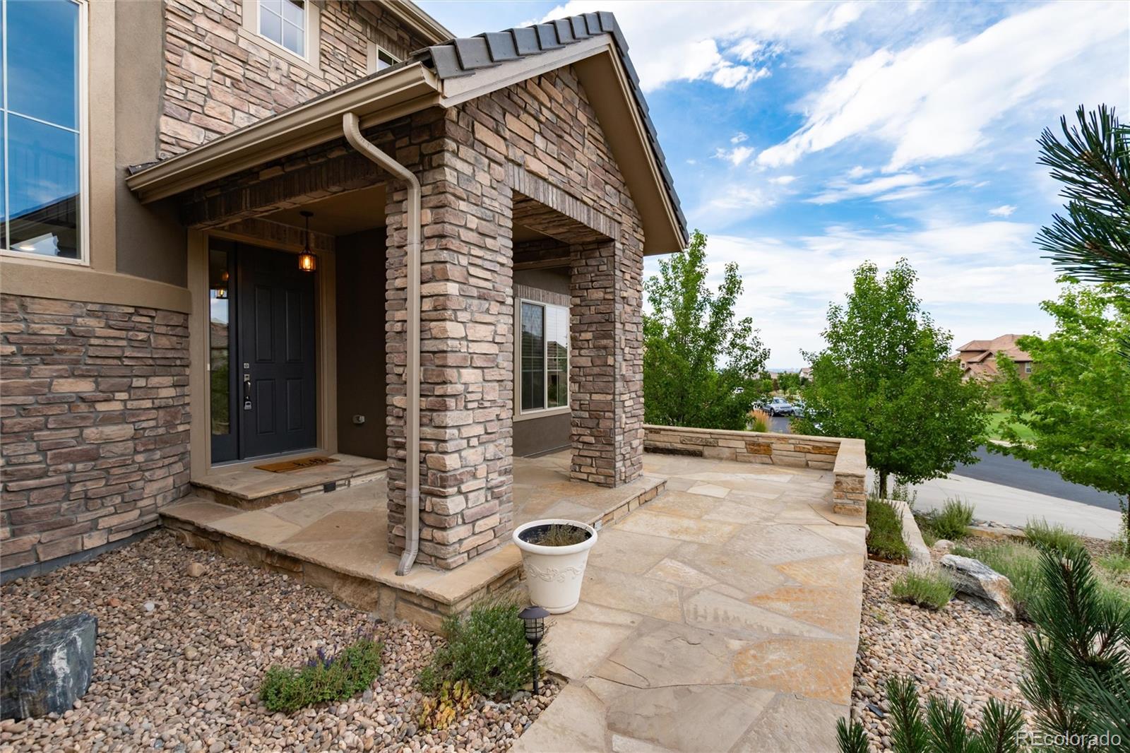 10703 Braesheather Court Highlands Ranch, CO 80126 - Photo 13 of 48 a view of a entryway door of the house