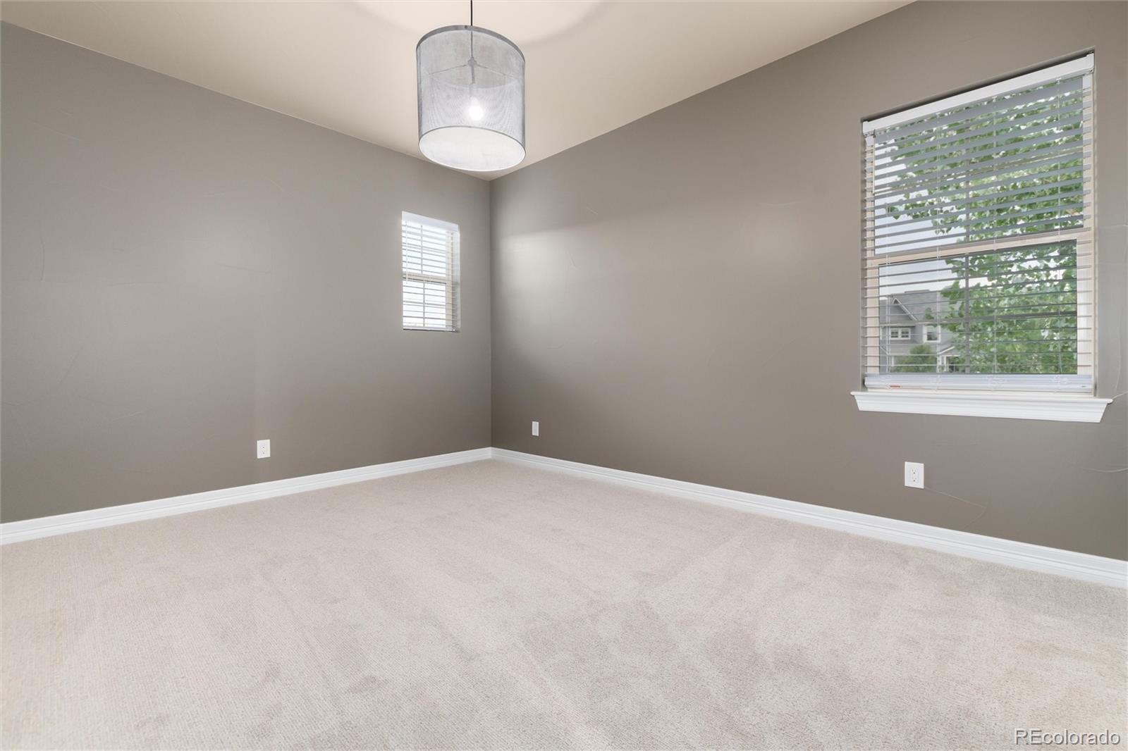 10703 Braesheather Court Highlands Ranch, CO 80126 - Photo 37 of 48 a view of an empty room with a window