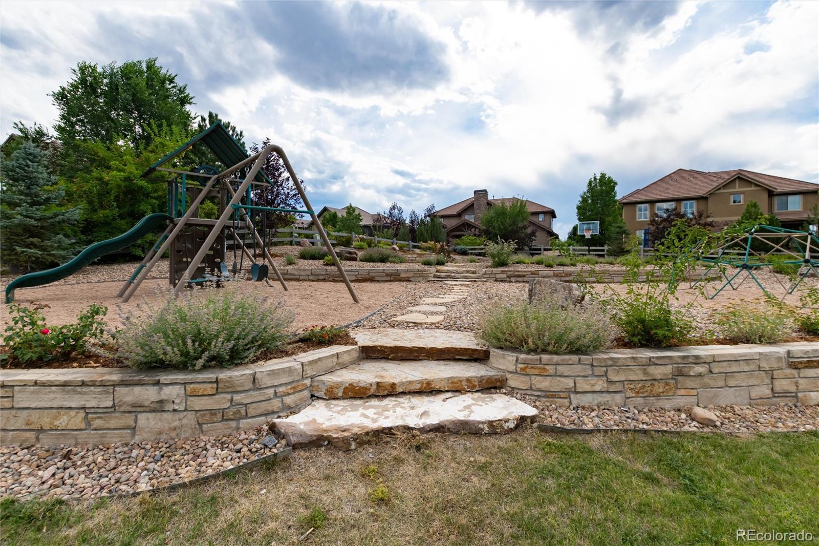 10703 Braesheather Court Highlands Ranch, CO 80126 - Photo 41 of 48 a view of a street with houses in the background