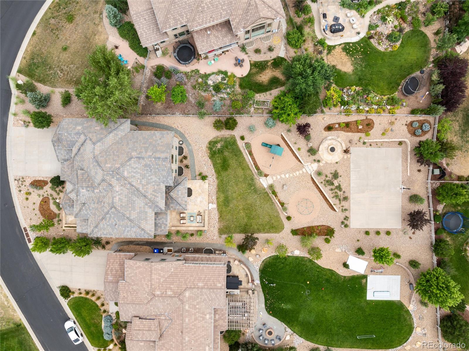 10703 Braesheather Court Highlands Ranch, CO 80126 - Photo 44 of 48 an aerial view of a house with a yard and a fountain