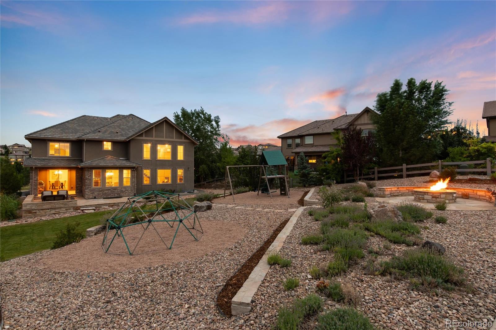 10703 Braesheather Court Highlands Ranch, CO 80126 - Photo 7 of 48 a view of a house with backyard and sitting area