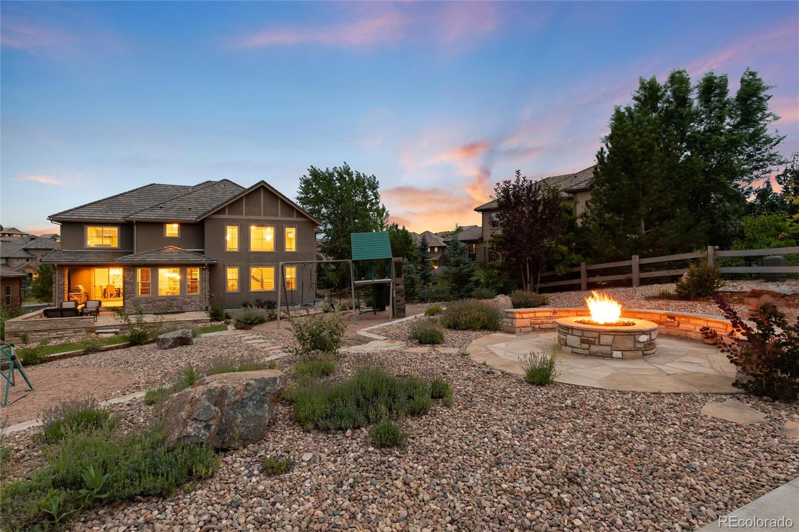 10703 Braesheather Court Highlands Ranch, CO 80126 - Photo 9 of 48 a view of yard with car parked