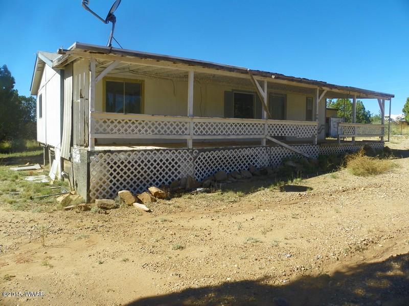 4452 East Pinto Road Snowflake, AZ 85937 - Photo 18 of 21 a front view of a house with a yard