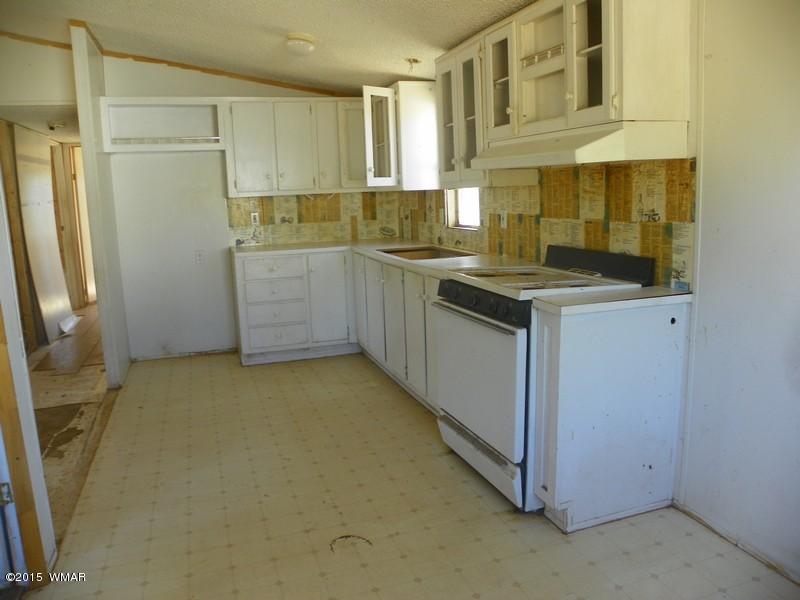 4452 East Pinto Road Snowflake, AZ 85937 - Photo 7 of 21 a kitchen with a sink and cabinets