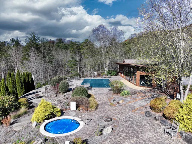 a view of a swimming pool with a patio
