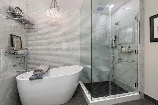 a bathroom with a bathtub and shower
