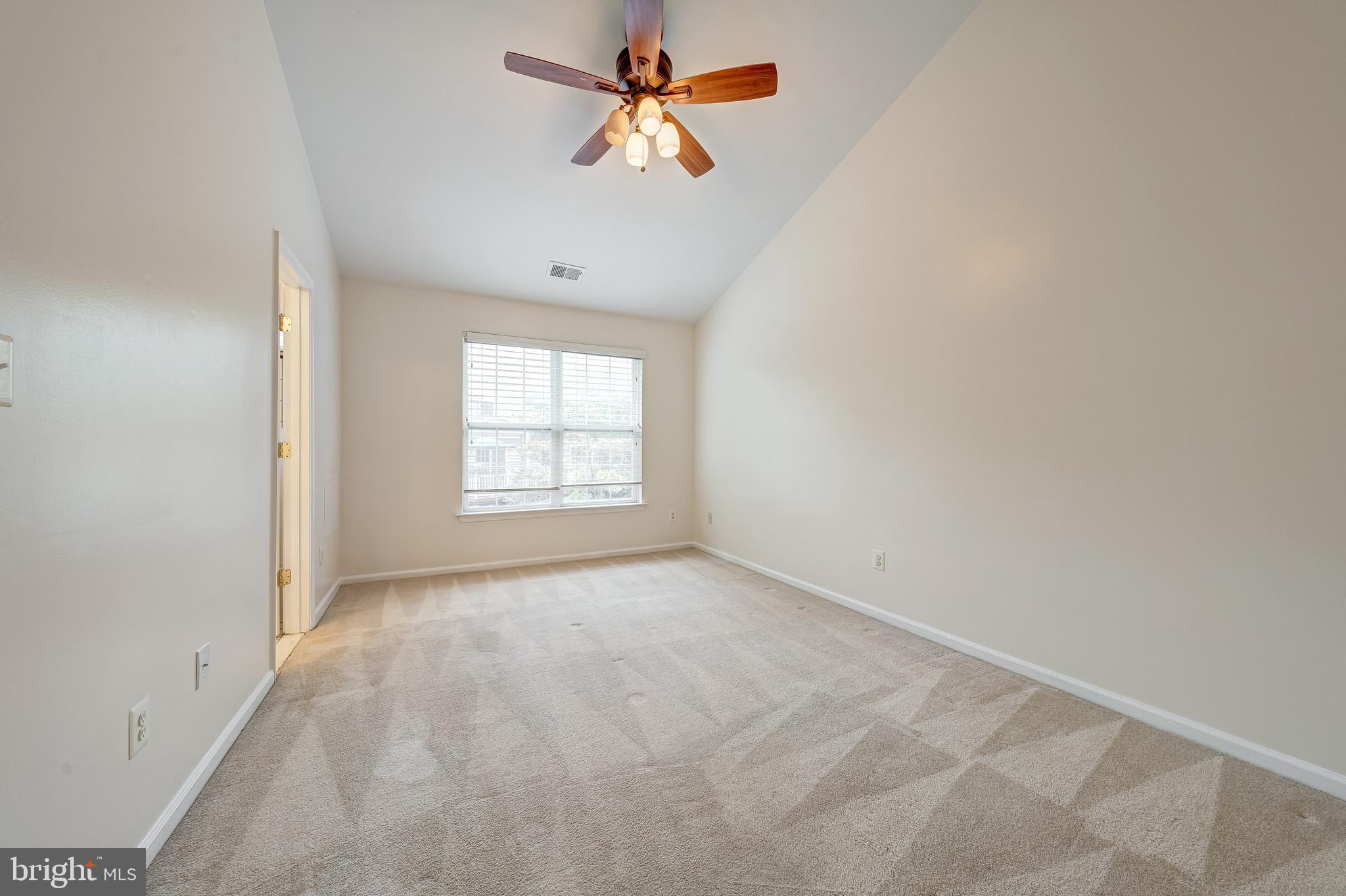 11444 Heritage Commons Way Reston, VA 20194 - Photo 16 of 35 wooden floor in an empty room with a window