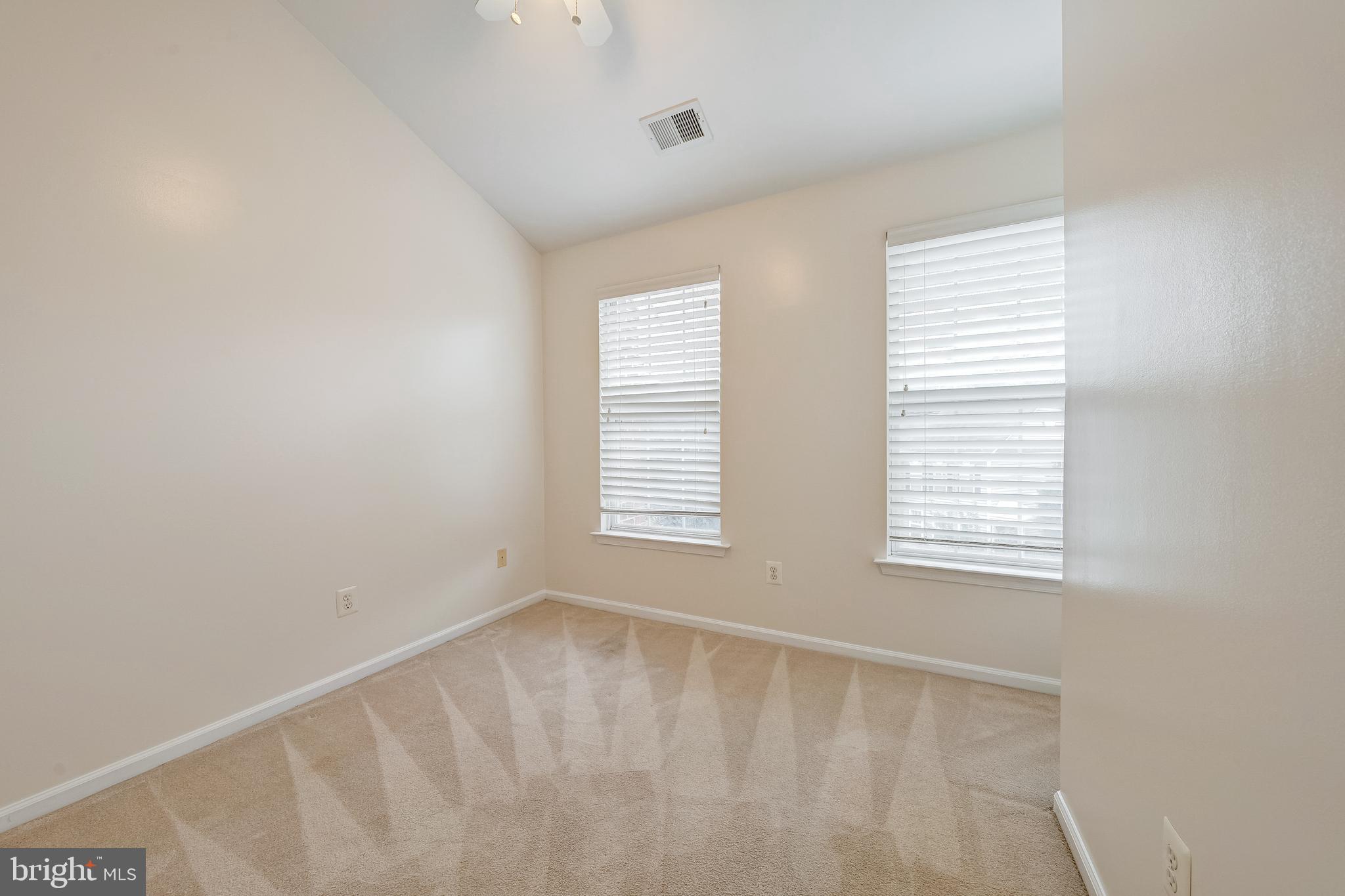 11444 Heritage Commons Way Reston, VA 20194 - Photo 21 of 35 a view of an empty room with a window