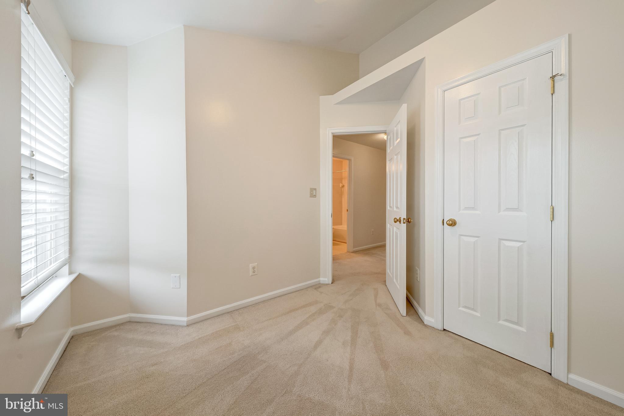 11444 Heritage Commons Way Reston, VA 20194 - Photo 22 of 35 an empty room with windows and closet