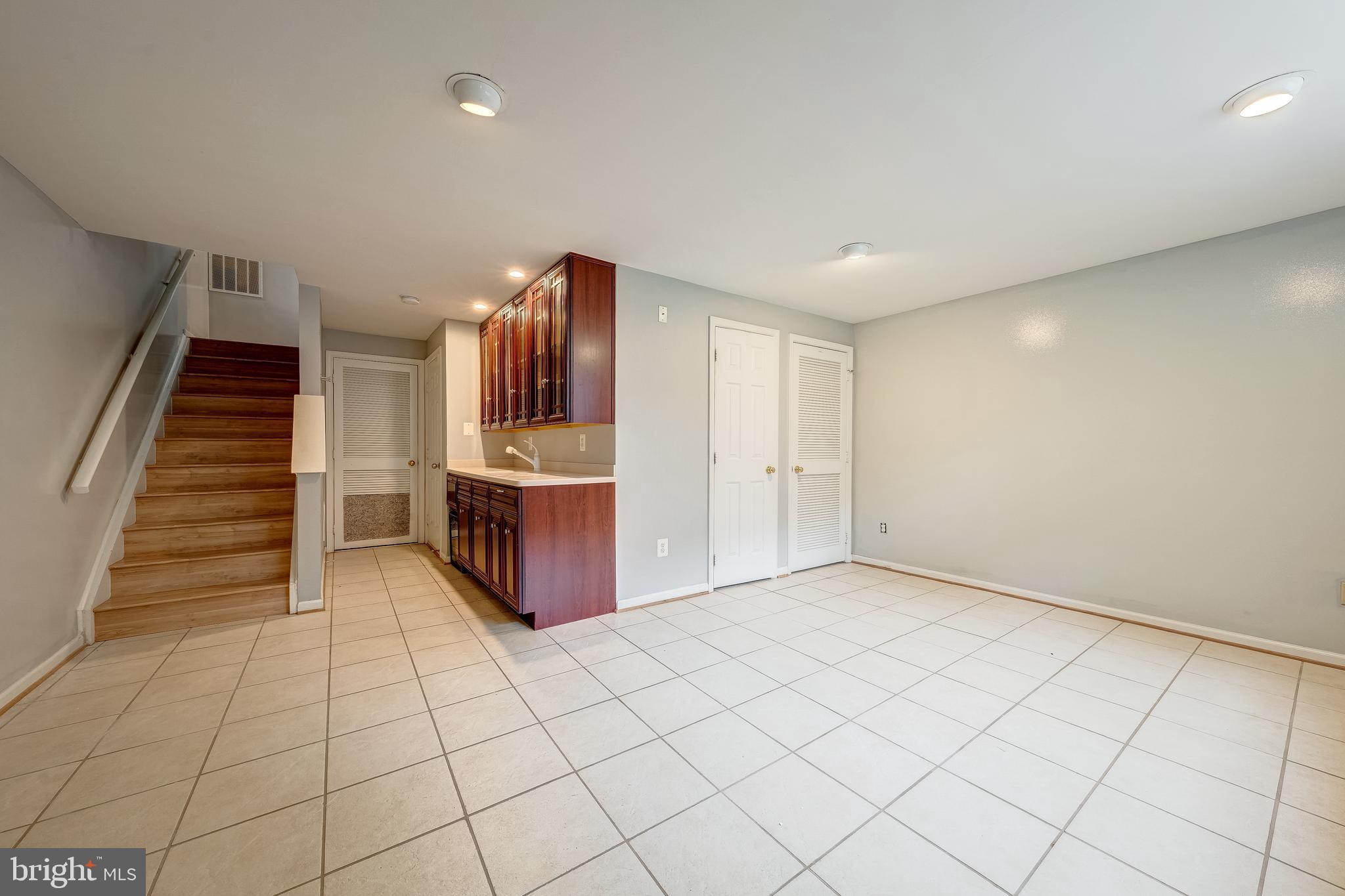 11444 Heritage Commons Way Reston, VA 20194 - Photo 27 of 35 a view of an empty room and stairs