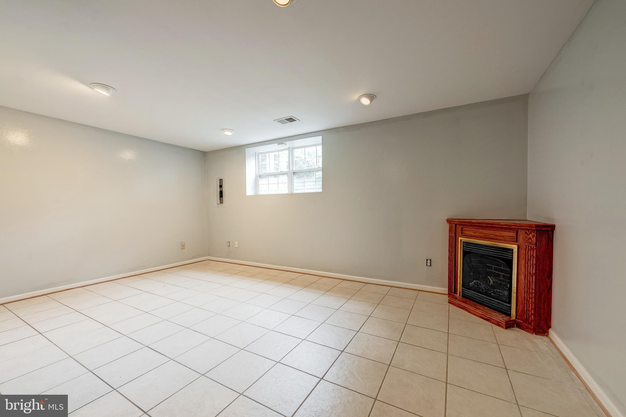 11444 Heritage Commons Way Reston, VA 20194 - Photo 28 of 35 a view of an empty room with a fireplace