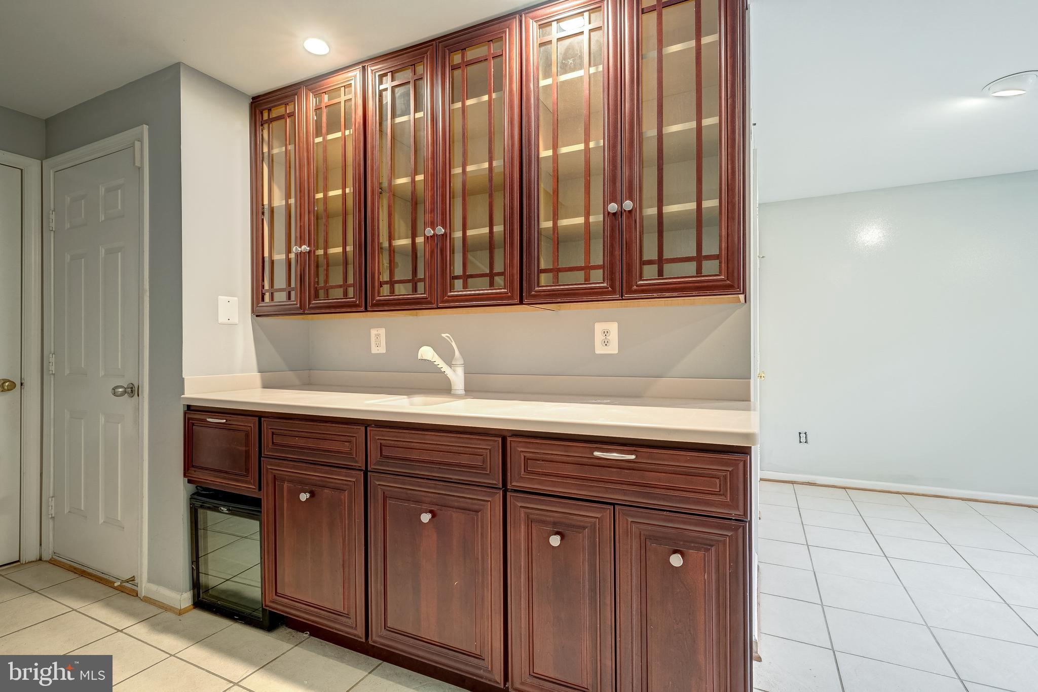 11444 Heritage Commons Way Reston, VA 20194 - Photo 30 of 35 a sink with a granite countertop cabinets